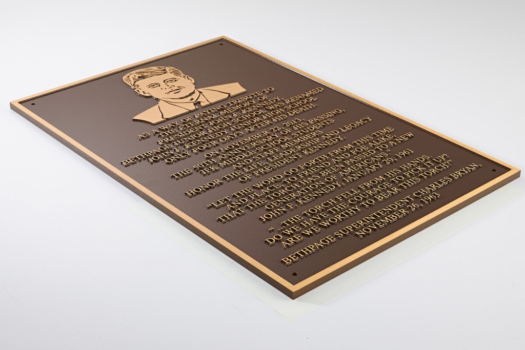 Bronze plaque with etched portrait and text